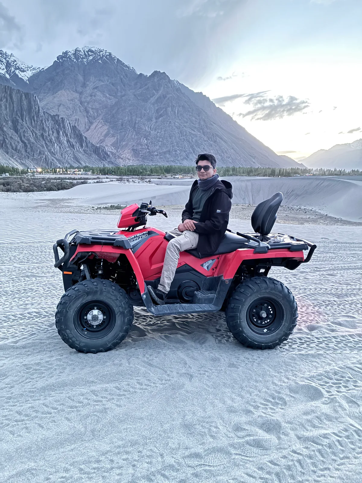 Dr Kunal Patankar riding an ATV in the Nubra Valley, Ladakh