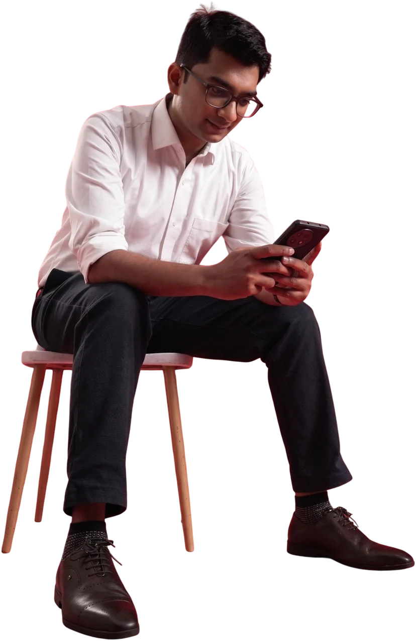 Dr Kunal Patankar reviewing messages on his phone